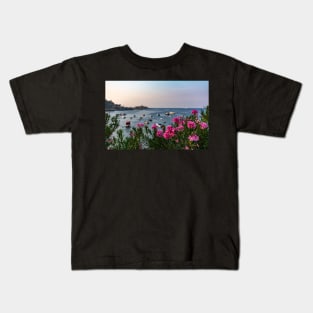 Pink Nerium oleander flowers with Malta Bay in the background Kids T-Shirt